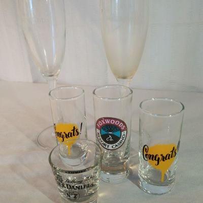 Assorted shot glasses and wine glasses