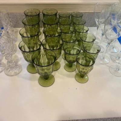 Lot #184  Olive Green Glassware with crystal candlesticks and vases 