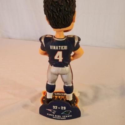 Adam Vinatieri bobblehead and Doug Flutie hat