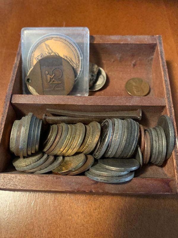 Wooden box of coins