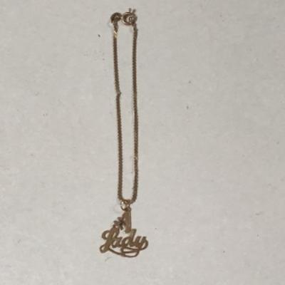 B3-105 14 karat gold charm on the bracelet