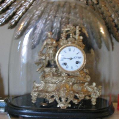 antique oval glass dome with mantle clock