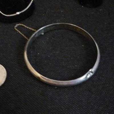 4 PIECES OF STERLING SILVER - 2 PAIRS EARRINGS, BANGLE AND NECKLACE