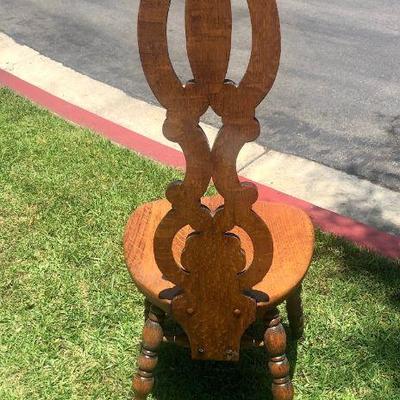 carved back wooden chair