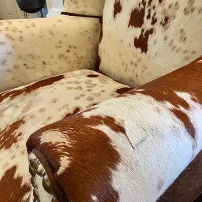 Authentic cow hide and suede wingback armchair in pristine condition