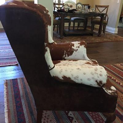 Authentic cow hide and suede wingback armchair in pristine condition