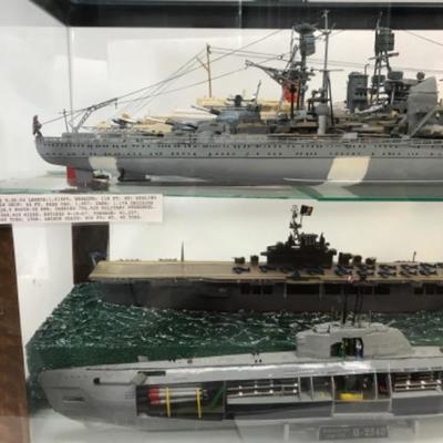 5 Completed ship models inside homemade display case