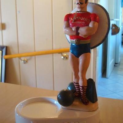 GR 113 - Vintage Bourbon Bottle Holder / Figure of Stongman