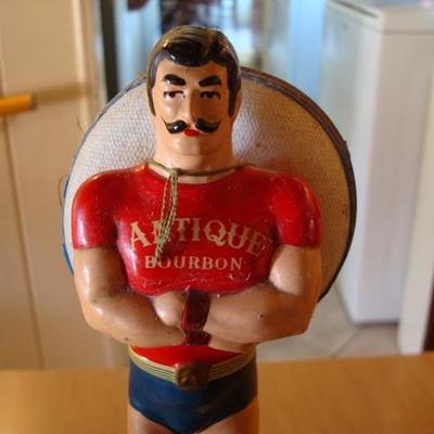 GR 113 - Vintage Bourbon Bottle Holder / Figure of Stongman
