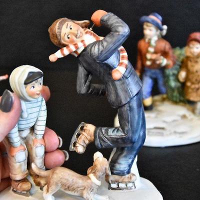 D Lot 62: Trio of Norman Rockwell Winter Figurines