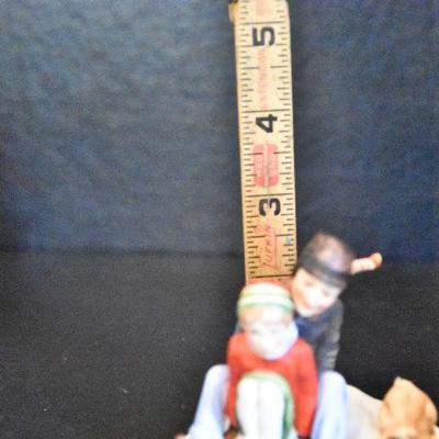 D Lot 62: Trio of Norman Rockwell Winter Figurines