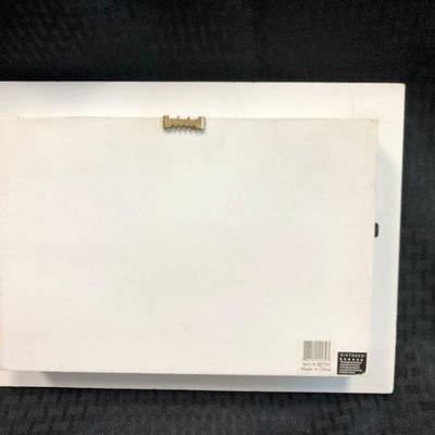 Miniature Kitchen Scene in 3D white frame with small bottles, miniature bread, wine grapes, corkscrew and shelf