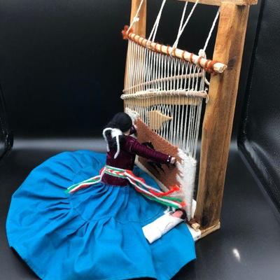 American Indian figurine using loom 