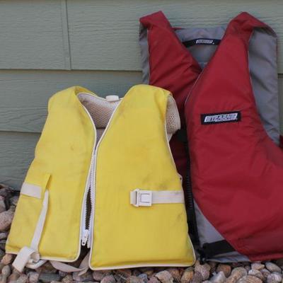 Lot 126: Vintage Stearnsâ„¢ Red Adult and Yellow Pee-Wee Safety Water Vests