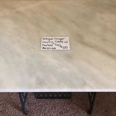 SINGER sewing table with marble top.