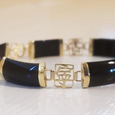 Lot 1: 14k and Black Onyx Chinese Character Bracelet 
