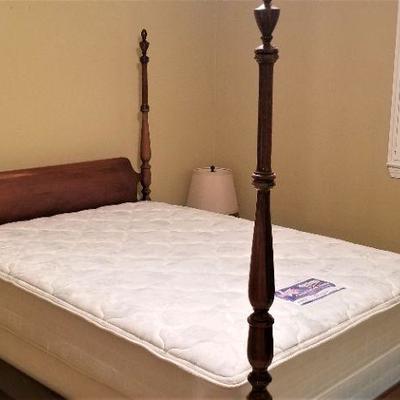 Lot #28  Double four poster bed with clean Serta Mattress