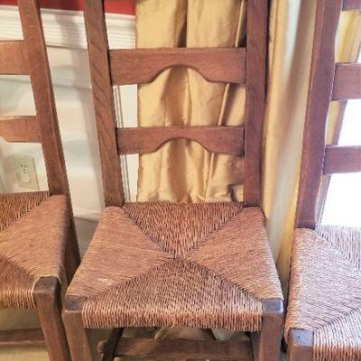 Lot #54  Set of Four Rush-bottomed trestle ladderback chairs