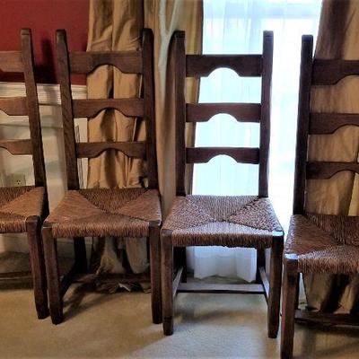 Lot #54  Set of Four Rush-bottomed trestle ladderback chairs