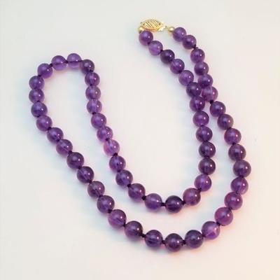 Lot #71  Natural Amethyst Bead necklace with 14Kt gold clasp.