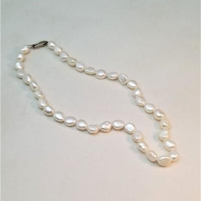 Lot #106  Nice strand of natural pearls with a sterling lobster claw clasp