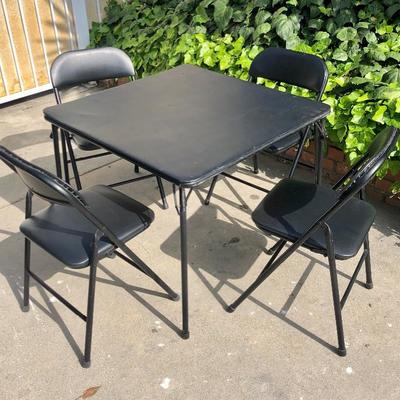 Folding card table and 4 folding chairs.