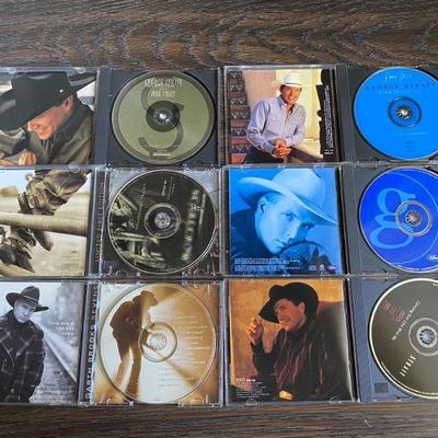 Lot of 3 George Strait CDs and 4 Garth Brooks CDs