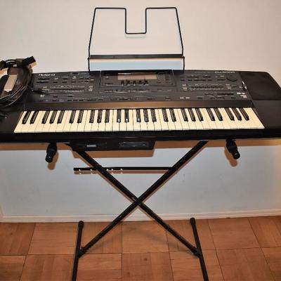 Lot 1011, ROLAND EM 2000 Synthesizer with Stand | EstateSales.org