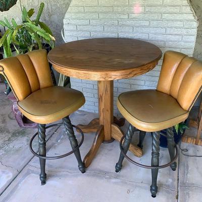 LOT 107 Vintage Oak Tall Table with two Swivel Bar Stools