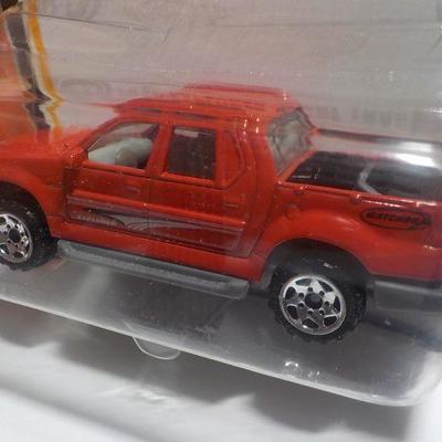 Hot wheels Lotus and Matchbox Ford explorer.