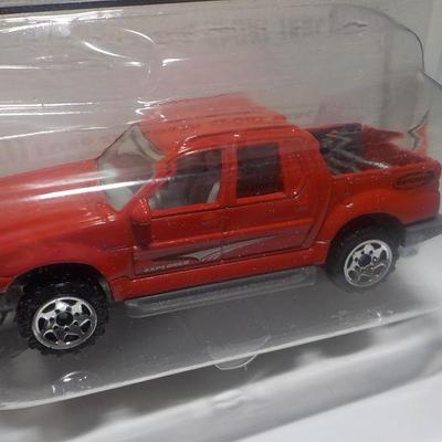 Hot wheels Lotus and Matchbox Ford explorer.