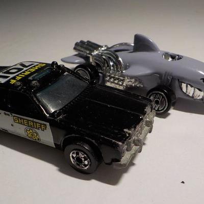 Cool police hot wheel and ultra shark mobile.