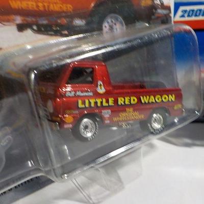 Show stopper little red wagon and hot wheel Holden.