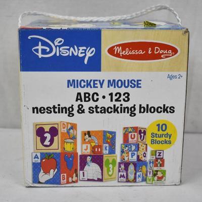 Melissa & Doug Mickey Mouse Nesting/Stacking Blocks. Outermost block is torn
