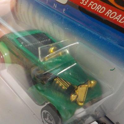 Hot wheels 33 ford roadster and Amalie Hawaiian.
