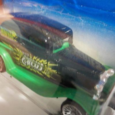 Wild man racer and hot wheels 1933 ford delivery.