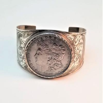 Lot #11  Beautiful Sterling Silver Cuff Bracelet, featuring a mounted 1887 Morgan Silver Dollar