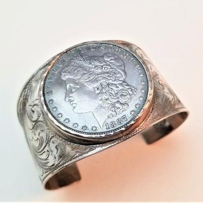 Lot #11  Beautiful Sterling Silver Cuff Bracelet, featuring a mounted 1887 Morgan Silver Dollar