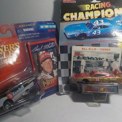 Bill Ellis # 14 muscle car and Kendall racing machine.