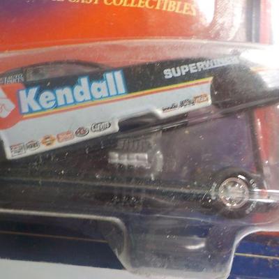 Bill Ellis # 14 muscle car and Kendall racing machine.