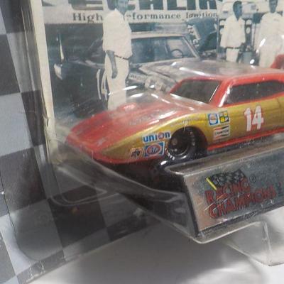 Bill Ellis # 14 muscle car and Kendall racing machine.