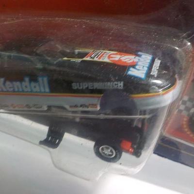 Bill Ellis # 14 muscle car and Kendall racing machine.
