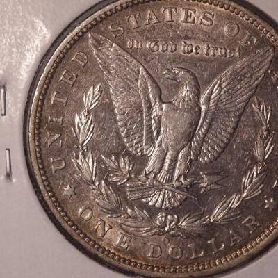 1887 O 7 Tail Feathers Morgan Silver Dollar  90