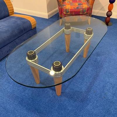 CONTEMPORARY OVAL GLASS TOP AND WOOD LEGGED COCKTAIL TABLE $375
