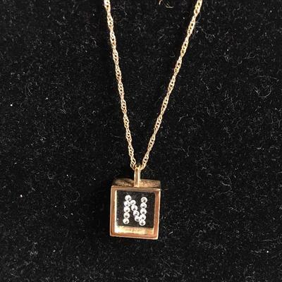 Lot 128 - Pair of 14K Necklaces with Pendants 