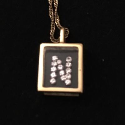 Lot 128 - Pair of 14K Necklaces with Pendants 