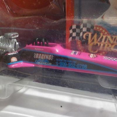 Top female fuel dragster and Bobby Labonte figure.