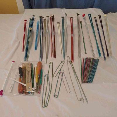 Assorted large and small knitting needles
