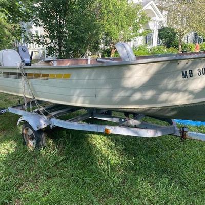 Lot # 610 Grumman 14’ Boat with NIssan Motor and Trailer 