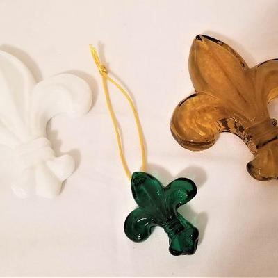 Lot #99  Three Studio glass Fleur di Lis ornaments from Studio Inferno